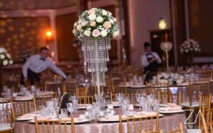 Luxury wedding reception catering setup with elegant table décor, floral centrepieces, and professional event arrangement