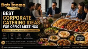 Professional corporate office meeting with authentic Syrian and Middle Eastern catering buffet by Bab Tooma Catering, featuring halal grilled platters, mezze, salads, and business professionals enjoying a productive meeting.