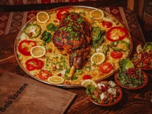 Lamb mandi with spiced rice and Middle Eastern salads