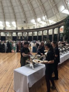 Professional wedding buffet catering service with guests enjoying Middle Eastern food in Leeds